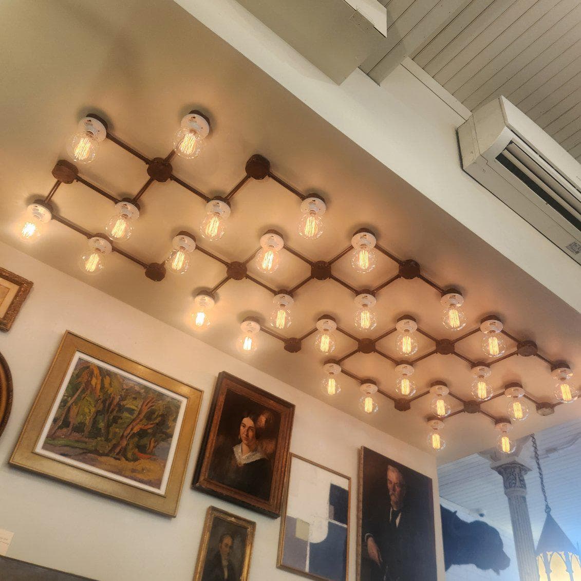 Living room with feature chandelier and lake view